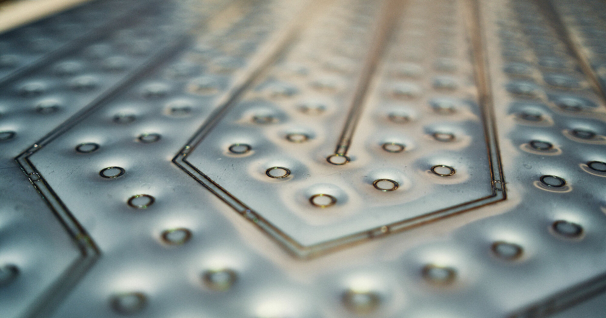 Close-up Shot of Cut Metal Shiny Silver Sheets Forming an Abstract