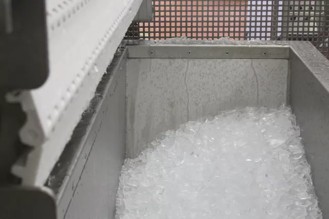 This image shows crushed ice dispensed from an ice machine. This image shows crushed ice dispensed from an ice machine.